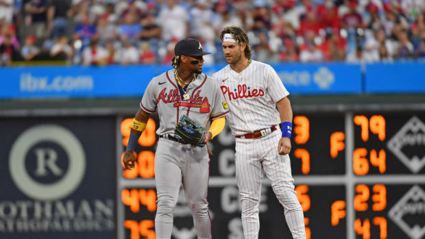Sep 13, 2023; Philadelphia, Pennsylvania, USA; Atlanta Braves right fielder Ronald Acuna Jr. (13) and Philadelphia Phillies designated hitter Bryce Harper (3) during the first inning at Citizens Bank Park. Mandatory Credit: Eric Hartline-USA TODAY Sports